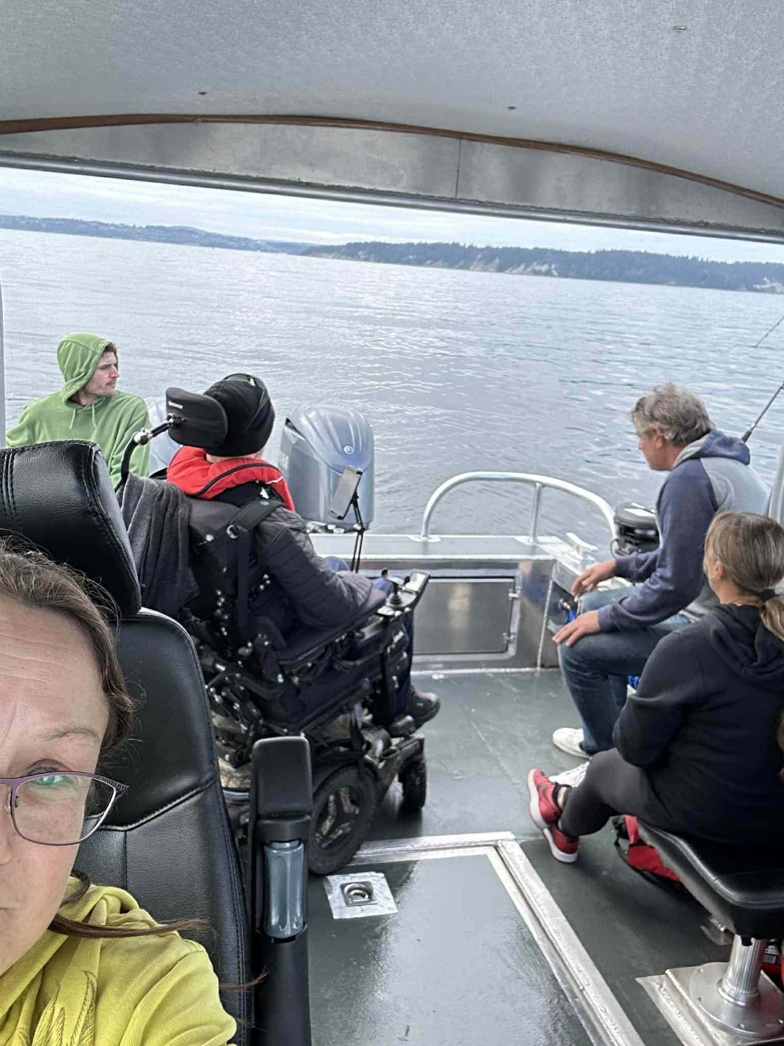 Friends enjoying an accessible fishing trip together